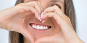 Woman smiling with a personalised natural and aesthetic smile design